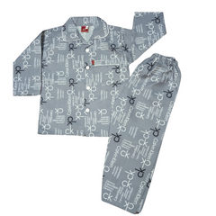 A set of boys' sleepwear, consisting of a shirt with a pattern of beds and bedding, and pants with a similar pattern, both in gray tones.